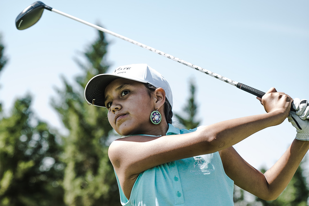 young girl at youth golf tournament showing why you need weather insurance for youth sports