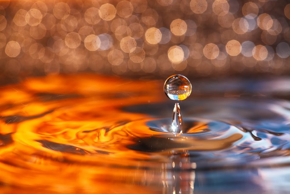 drop of water close-up during rain storm to represent needing weather insurance for insurance brokers and agents