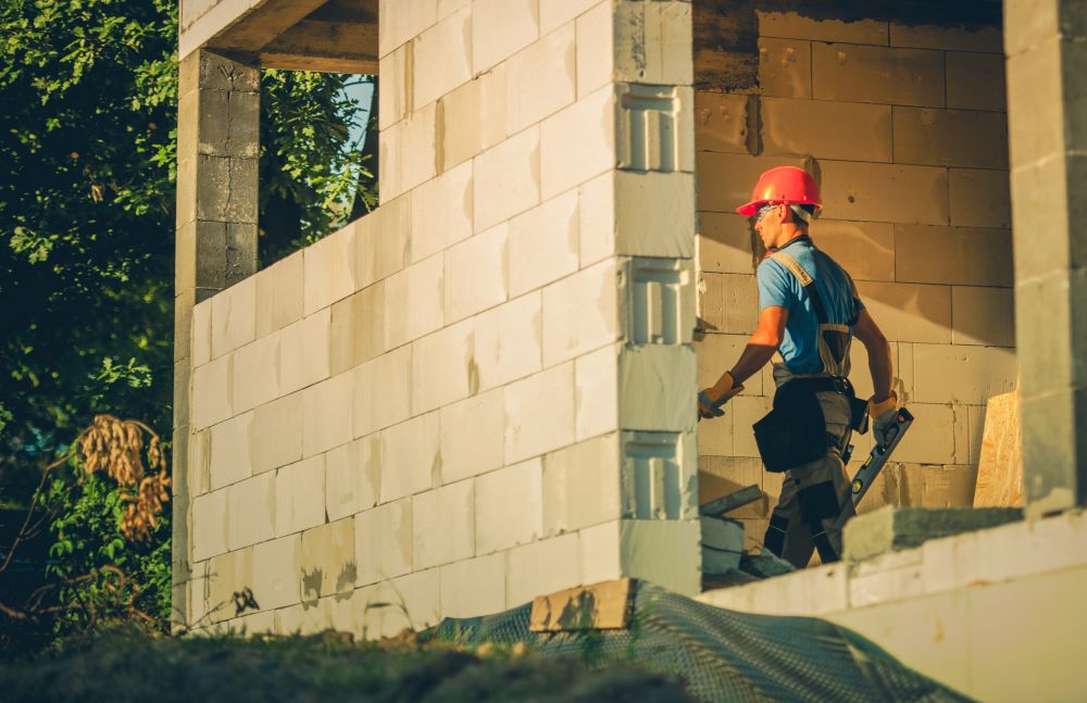 construction worker rebuilding a business using money from vortex hurricane insurance