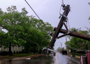 tree-and-electric-pole-on-after-hurricane-damage-needing-hurricane insurance from Vortex.