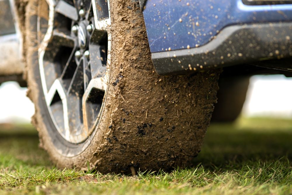 slippery dirty car wheel from parking in concert lot as part of concern for music festival risk management plan