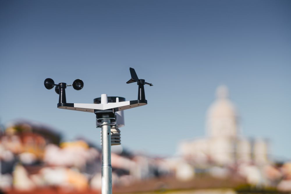 Device on a rooftop for gathering and measuring weather information to help show how weather data is used.